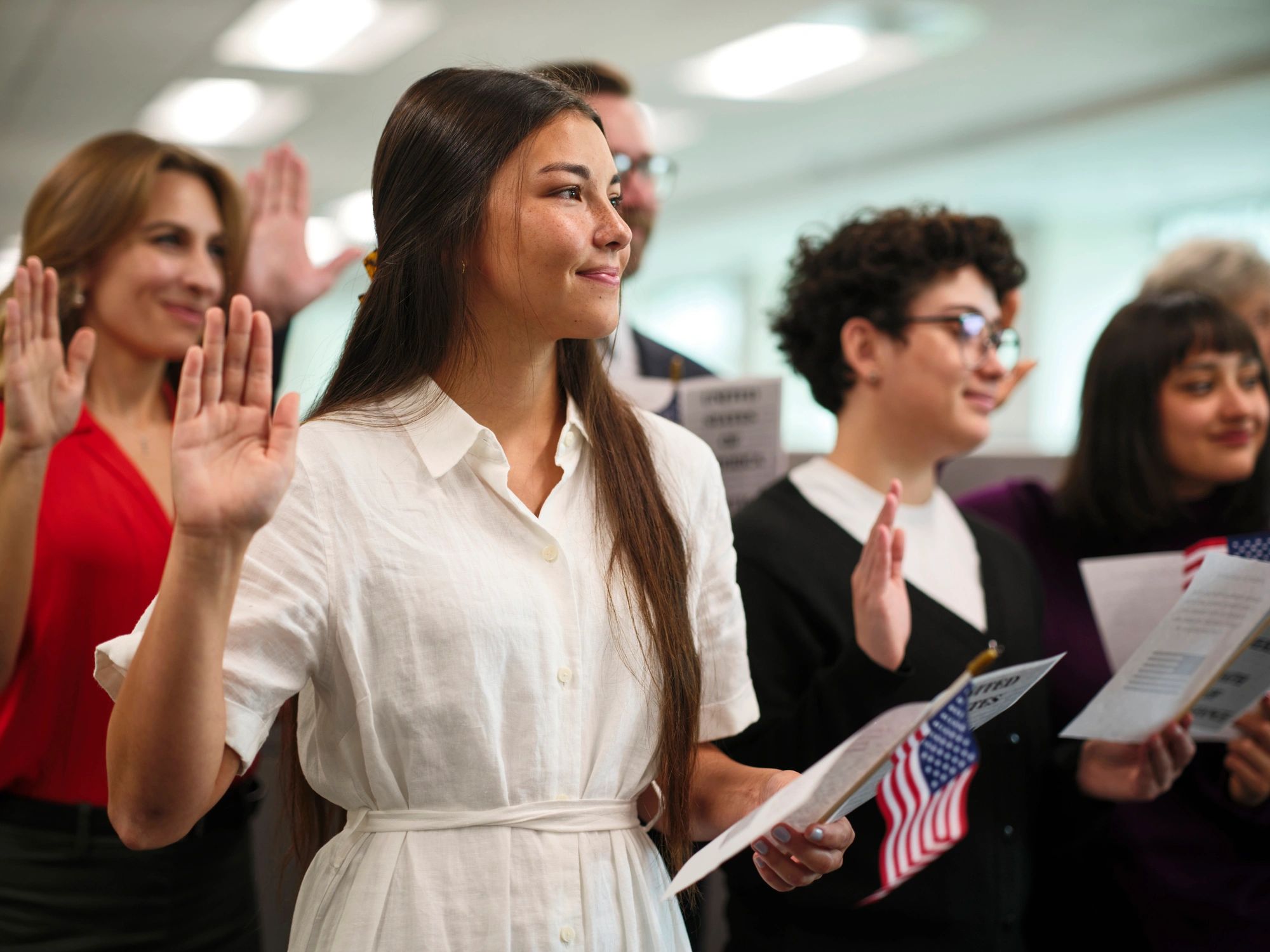 Group of people taking an oath at a ceremony