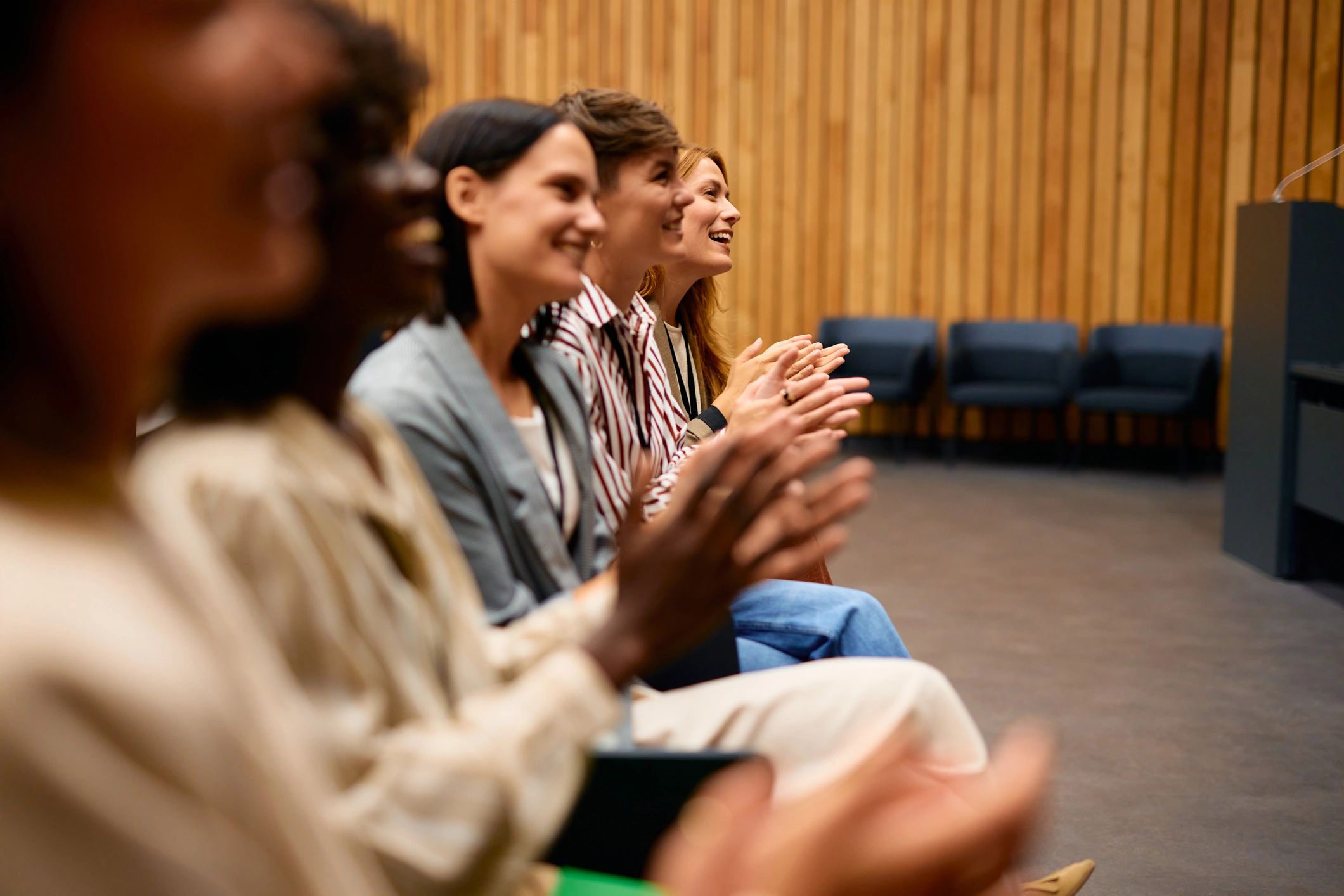 Audience applauding at a town hall-style event